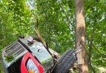East Columbia Street closed for several hours after roll-off bin truck drives off road