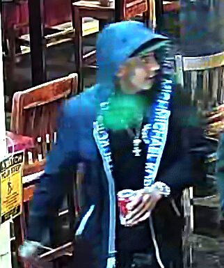 One charged, one suspect at large in Granville Street face-slashing